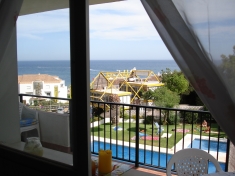 View through the kitchen window, across the garden to the Mediterranean Sea